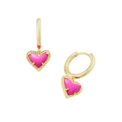 Gold heart pendant hoop earrings with vivid pink heart stone and textured gold border