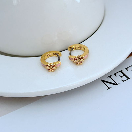 Geometric hoop earrings in gold with pink enamel accents, small circular design