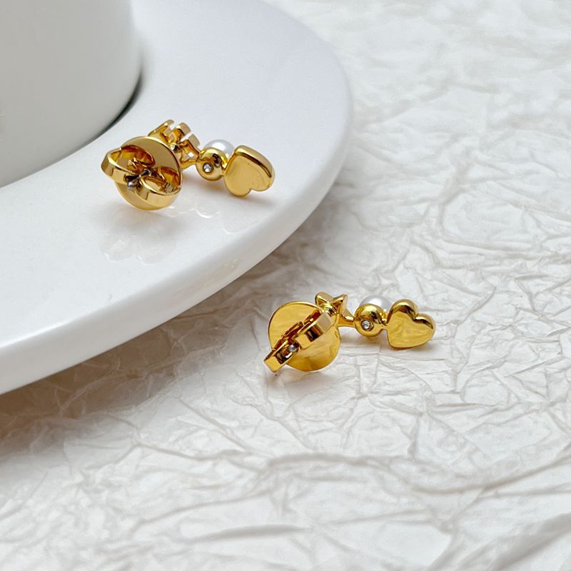 Tory Burch gold-tone earrings with heart and star motifs and pearl bead details