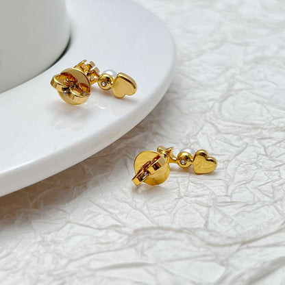 Tory Burch gold-tone earrings with heart and star motifs and pearl bead details