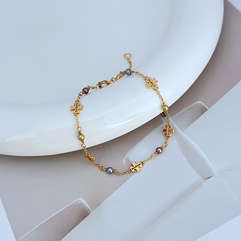 Gold-tone chain bracelet with freshwater pearls and logo cutout links