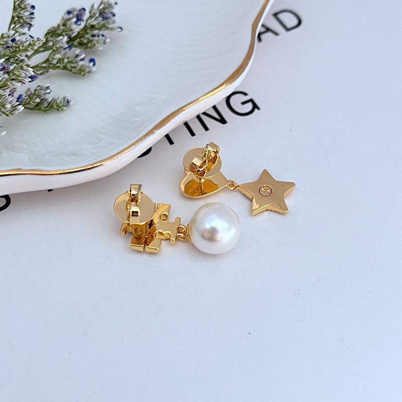 Gold-tone star and heart drop earrings with rhinestone detailing and white pearl