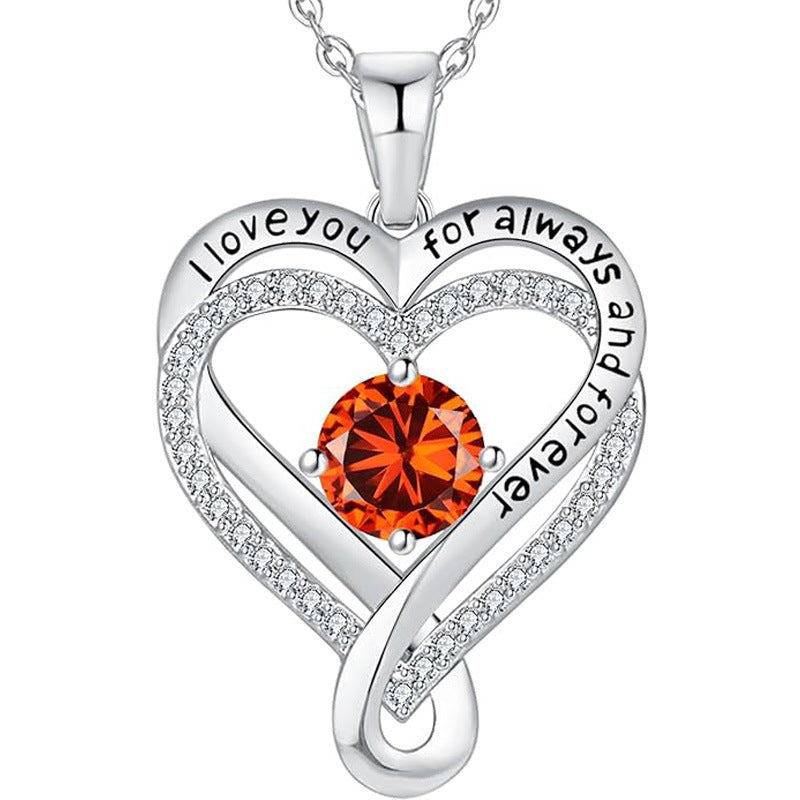 Silver heart pendant necklace with orange round gemstone and pave heart halo