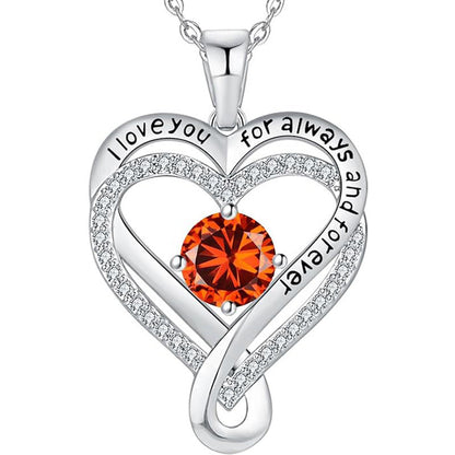 Silver heart pendant necklace with orange round gemstone and pave heart halo