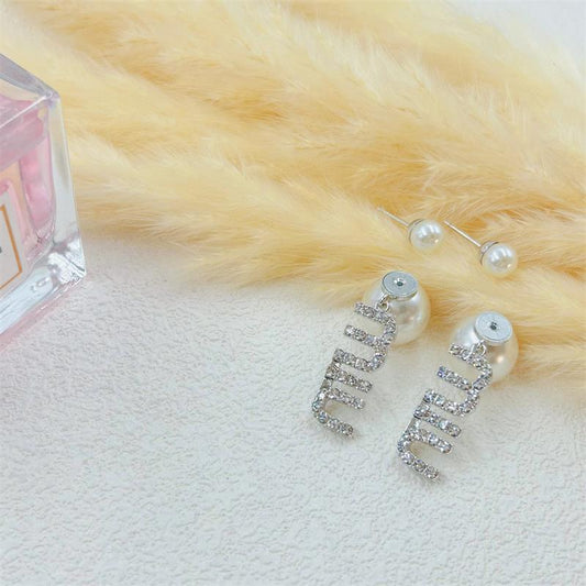 Pearl and diamond drop earrings with twin pearls and linked crystal design