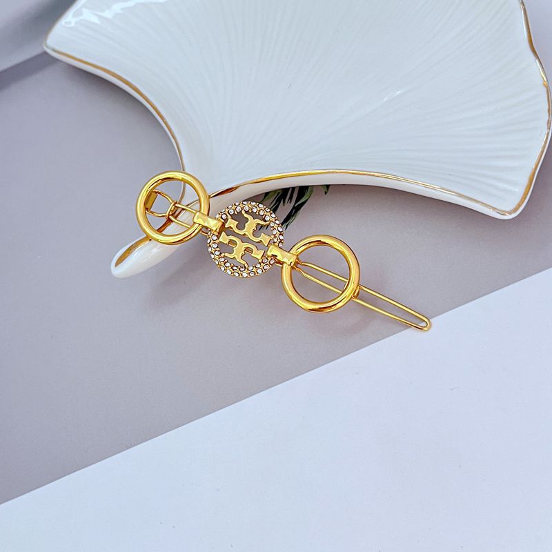 Tory Burch Diamond-Studded Round Metal Hair Clip
