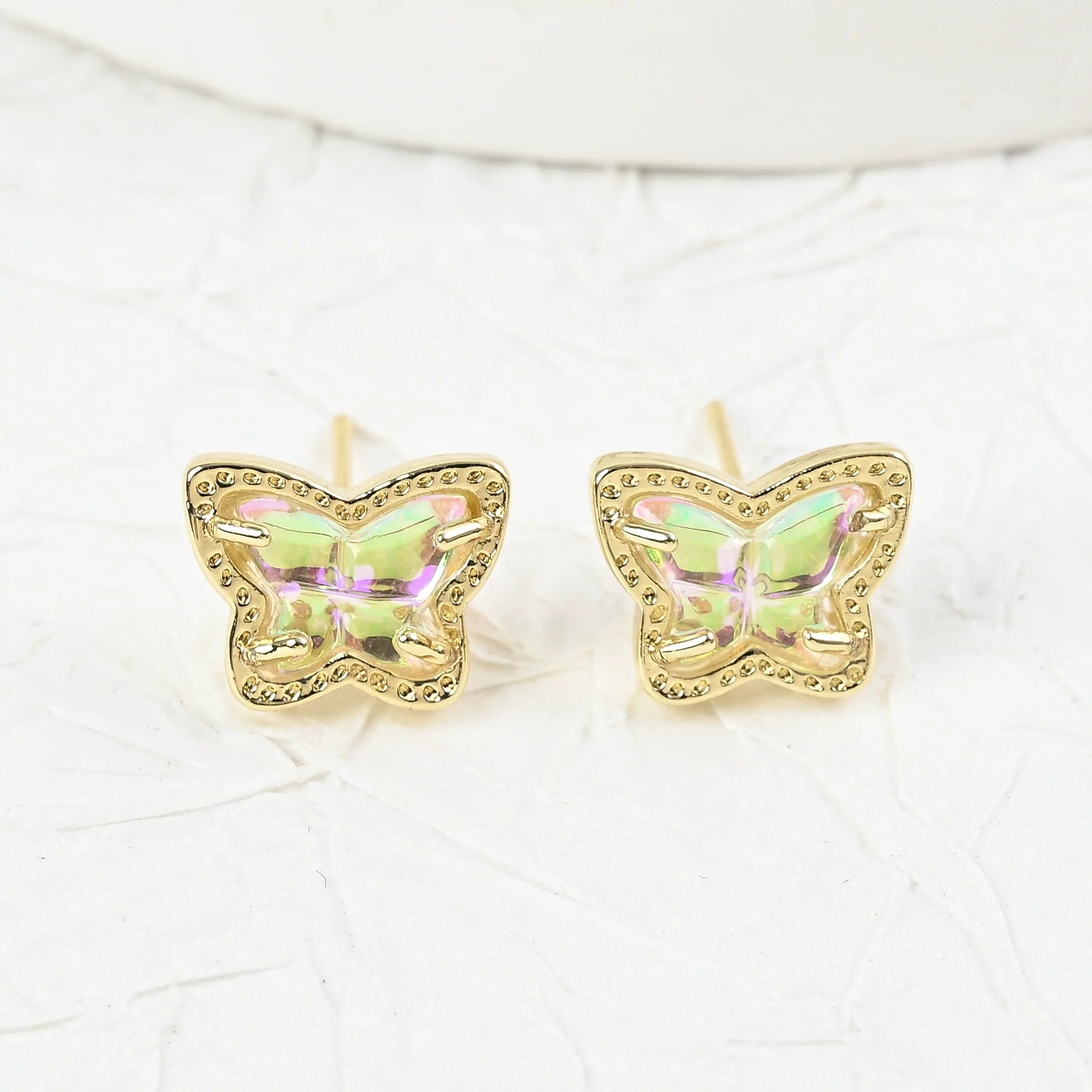 Gold butterfly stud earrings with iridescent multi-color stones, pair