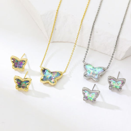Butterfly necklace and stud earrings set showing gold and silver tones with iridescent stones