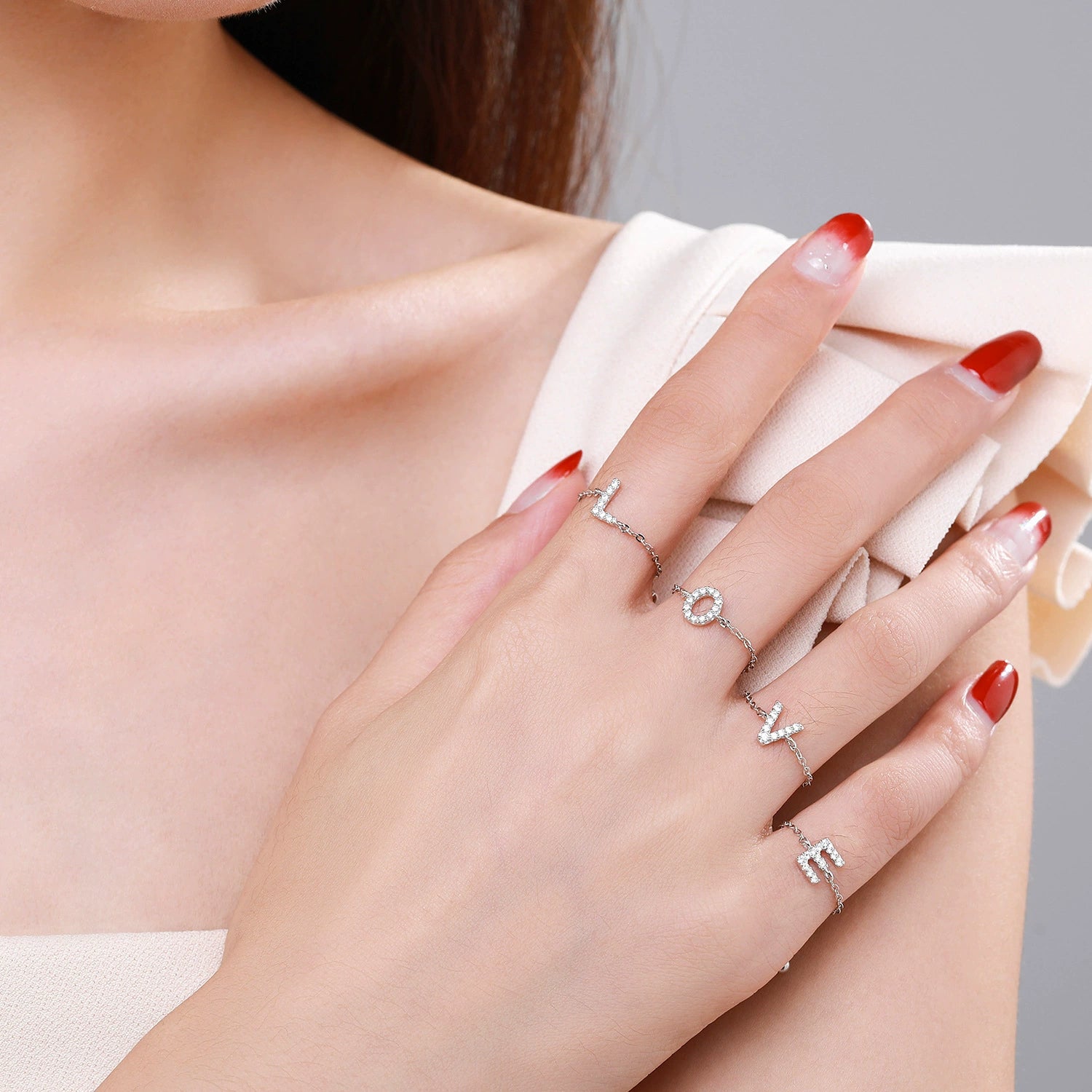 Pavé initial letter bracelet in sterling silver shown on hand