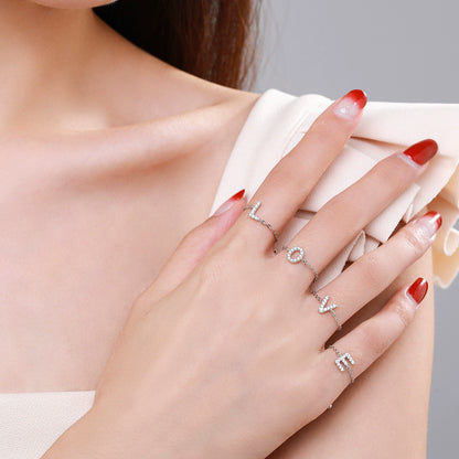 Pavé initial letter bracelet in sterling silver shown on hand
