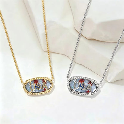 Oval USA letter pendant necklace, gold and silver-tone with blue enamel border