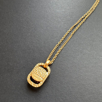 Hammered gold-tone square pendant necklace with cutout center and looped bail on chain