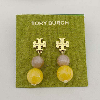 Tory Burch logo pendant earrings with gold-tone emblem and two-tone agate beads, yellow drops