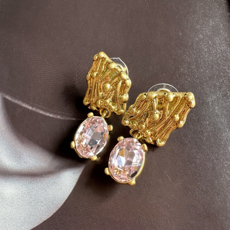 Gold-tone crystal drop earrings with oval pink stones