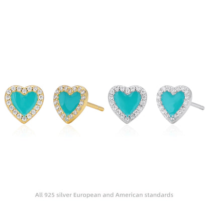 Assorted heart stud earrings in gold and silver tones with turquoise centers and clear stones.
