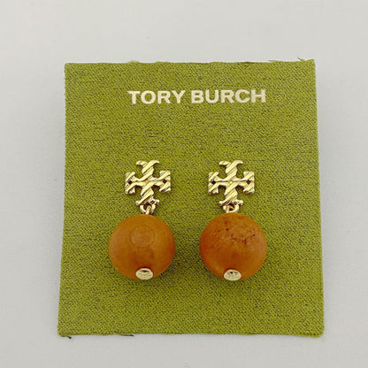 Tory Burch logo beaded pendant earrings, amber round beads, gold tone logo studs