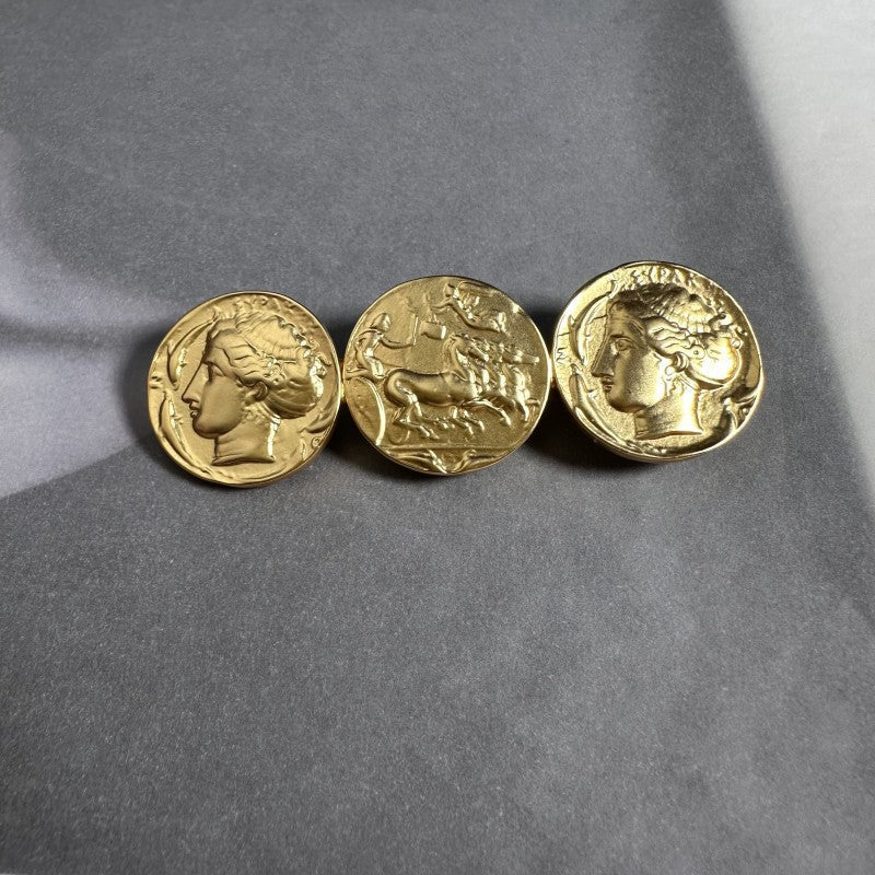 Gold-tone coin brooch with three round profile coins in aged finish