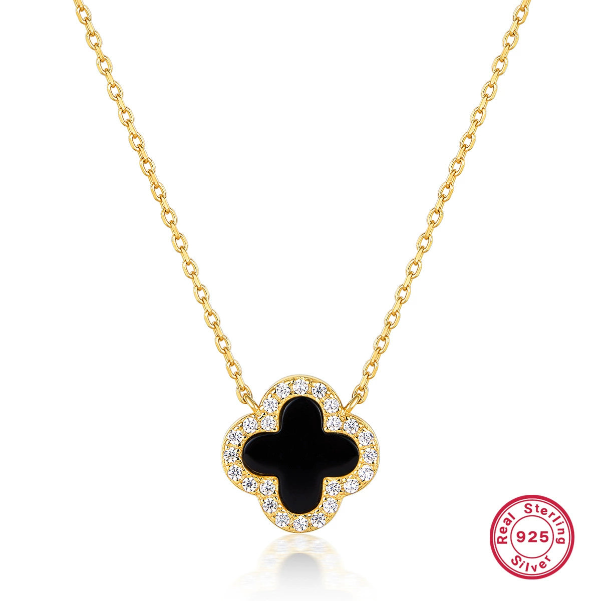 Gold-tone four-leaf clover necklace with black onyx center and clear stone border
