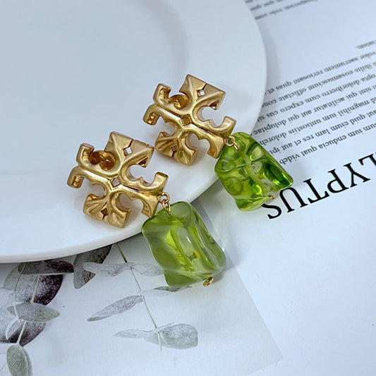 Gold-tone logo pendant earrings with green acrylic drop charms