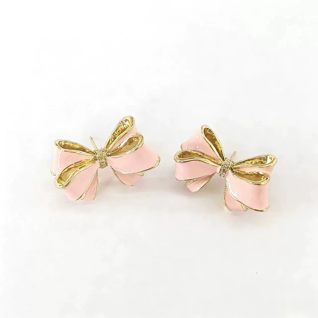 Pink enamel bow pearl drop stud earrings with gold-tone ribbon and hanging pearl
