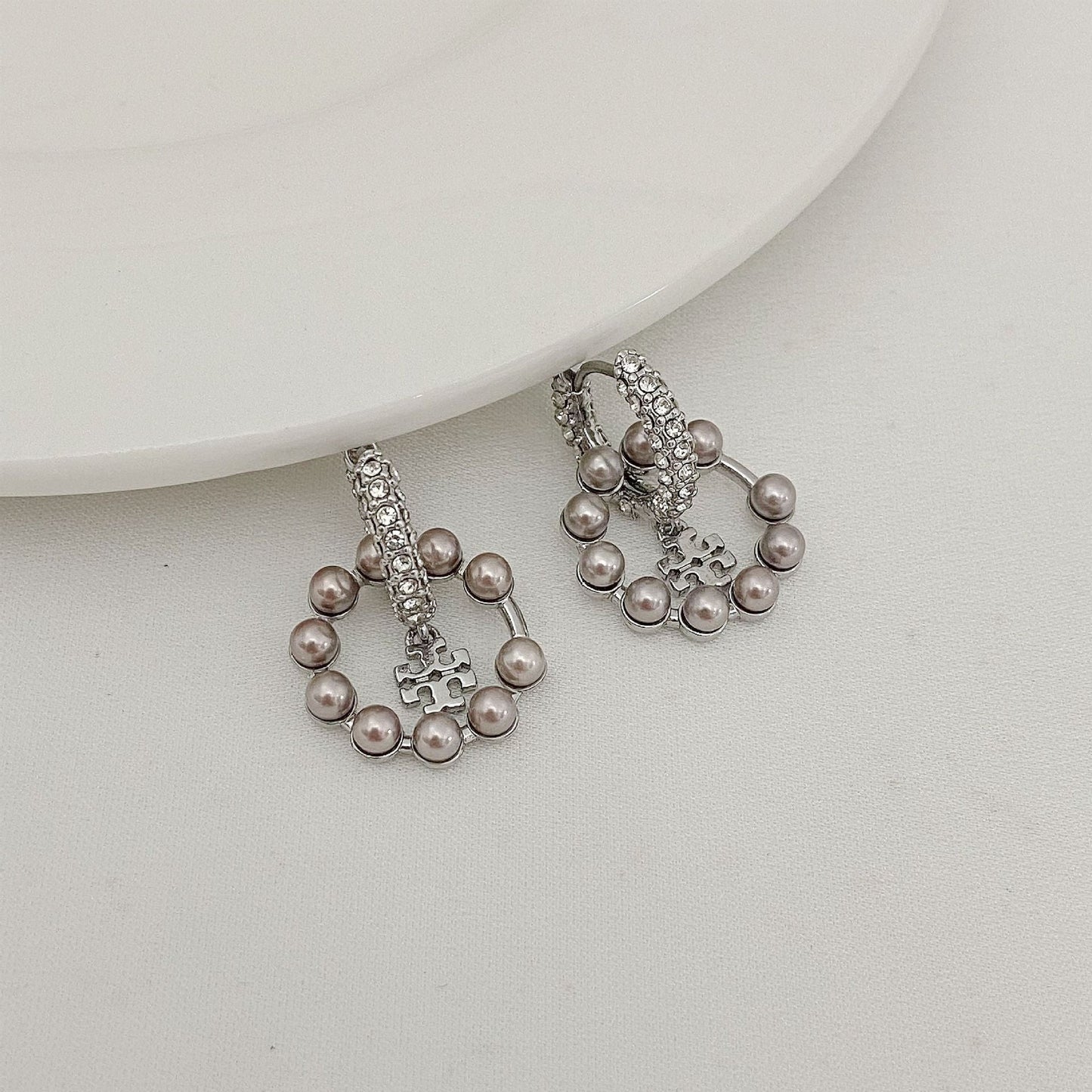 Silver-tone pearl and rhinestone drop hoop earrings with small cross charm