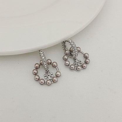 Silver-tone pearl and rhinestone drop hoop earrings with small cross charm