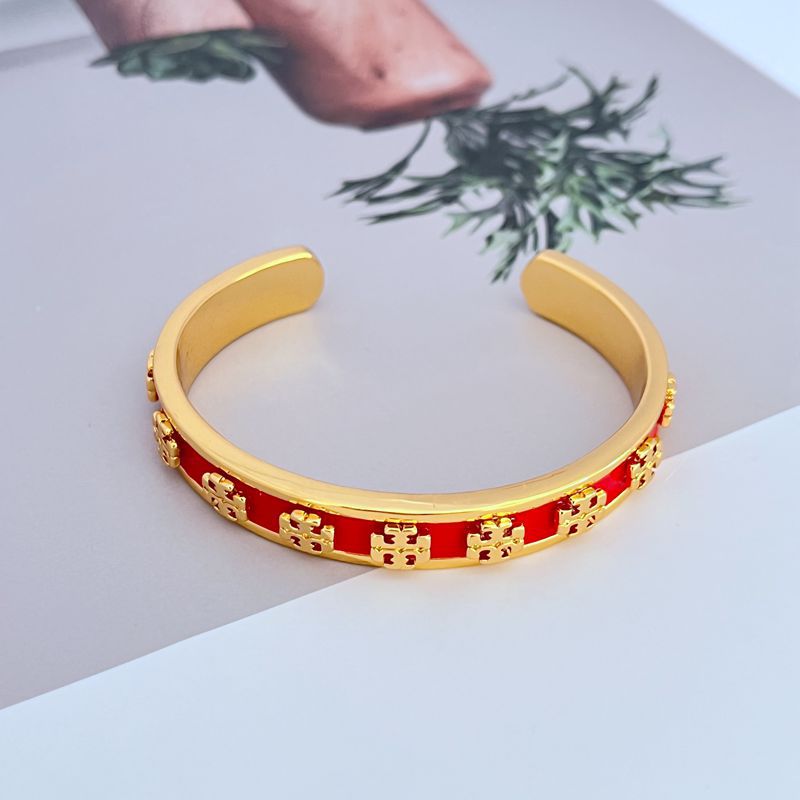 Enamel logo open metal bangle, red enamel band with gold-tone logo trim
