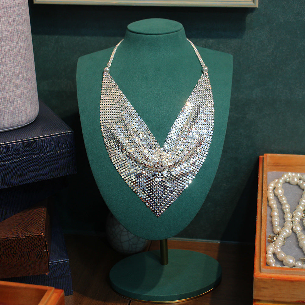 Silver sequin statement necklace with layered V shape and dangling chain