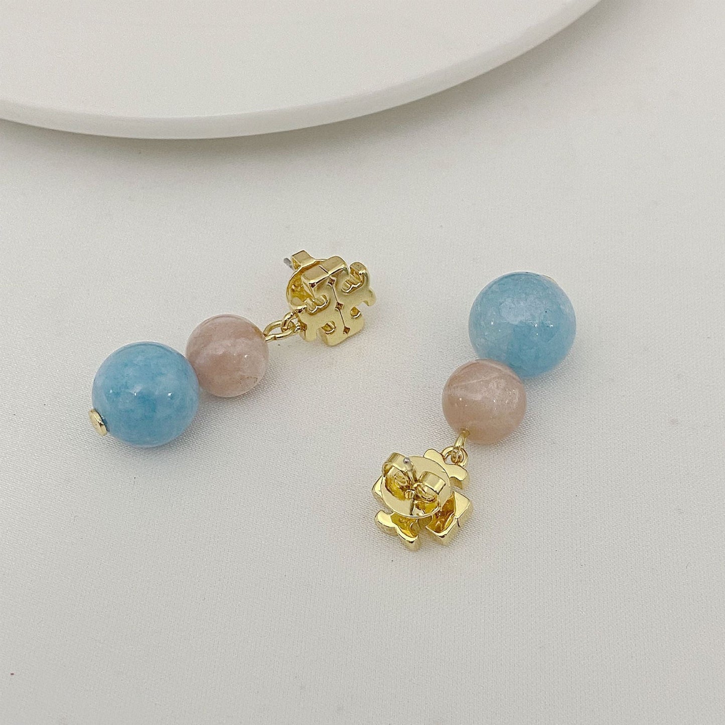 Tory Burch logo pendant earrings with light blue and pale pink agate beads