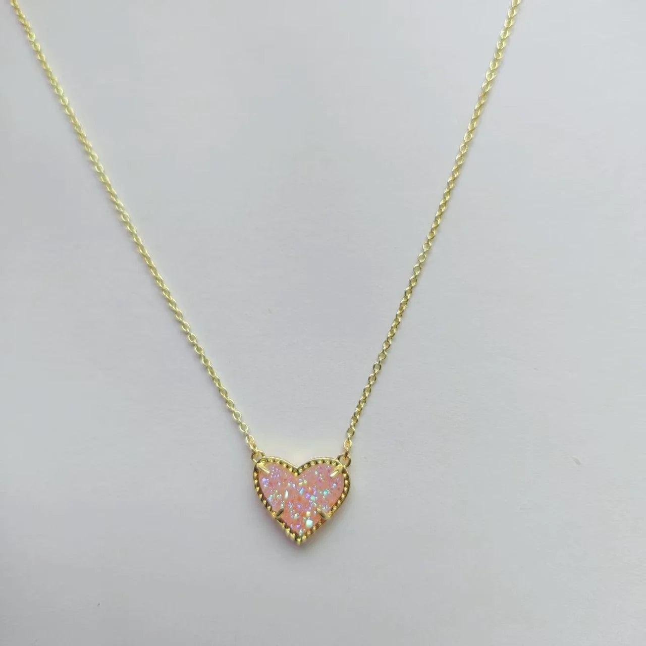 Heart pendant necklace with pink glitter heart and gold-tone chain