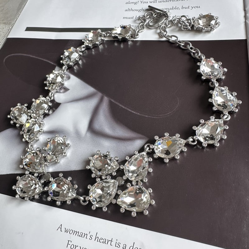 Silver-tone crystal necklace with clear round stones and linked chain