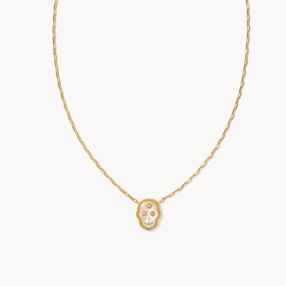 Gold chain necklace with white skull face pendant