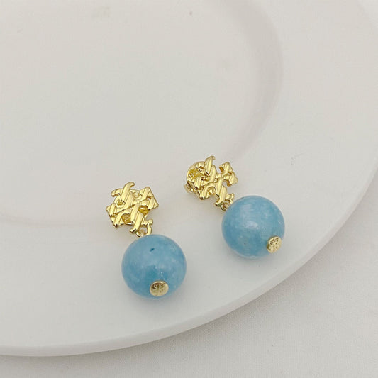 Gold-tone logo charm pendant earrings with round blue agate beads