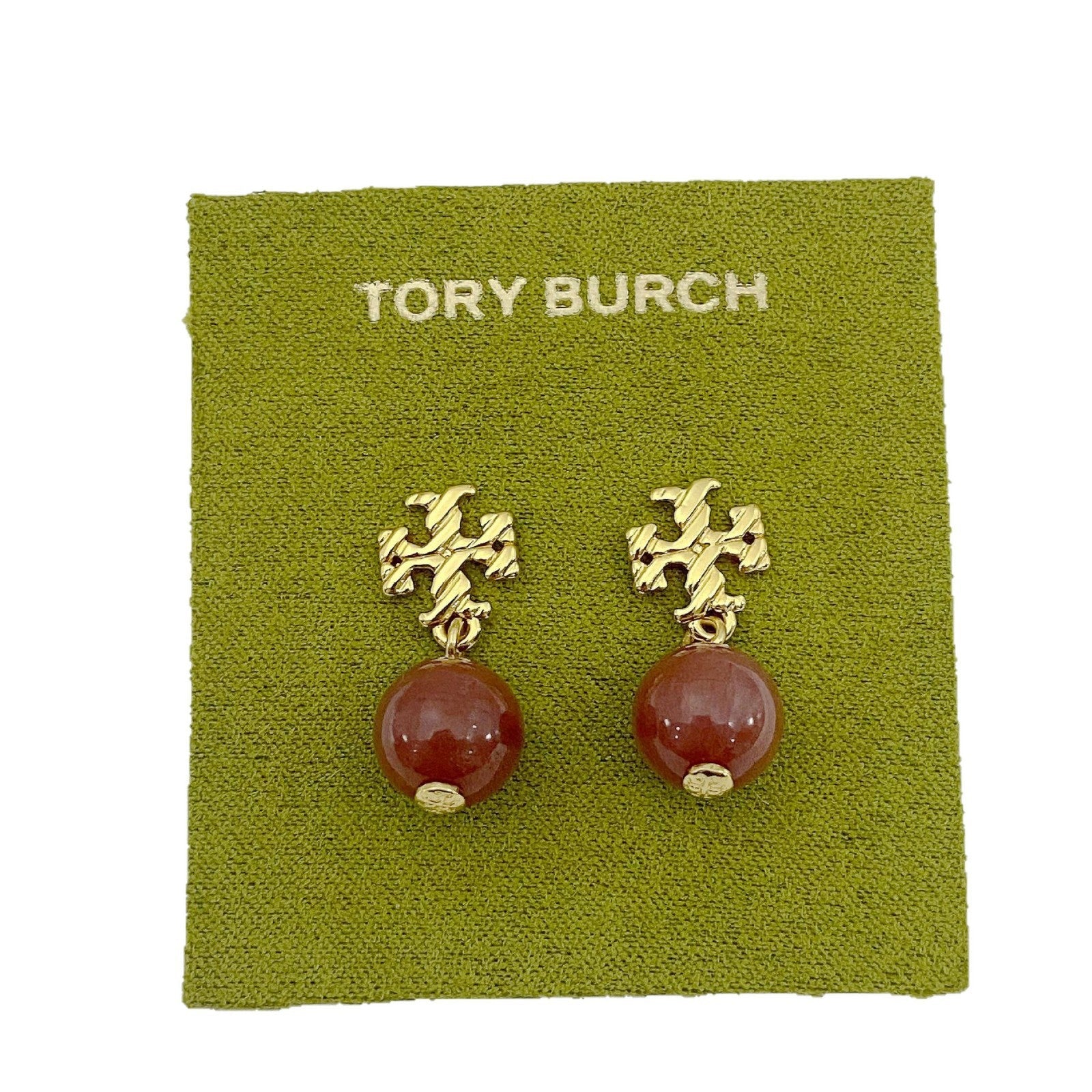 Gold-tone agate pendant earrings with round red stones and leaf-like top motif