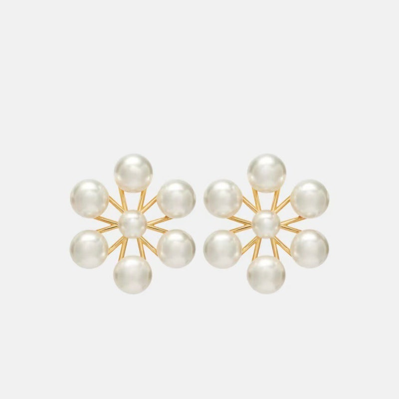 Pearl floral drop earrings with gold-tone starburst frames and multiple round pearls