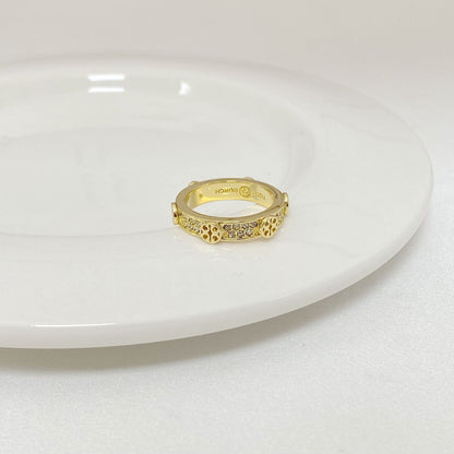 Gold-tone rhinestone ring with round bezel, centered stones on top