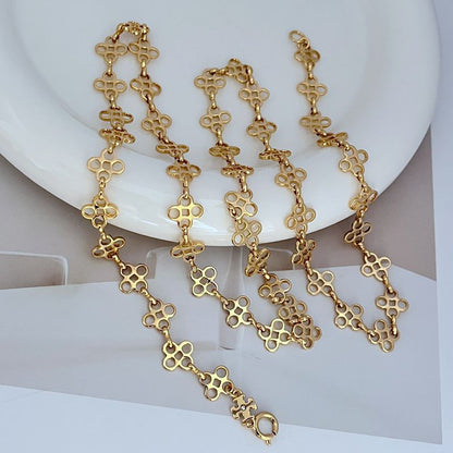 Four-leaf clover sweater chain necklace with gold-tone linked pendant drops