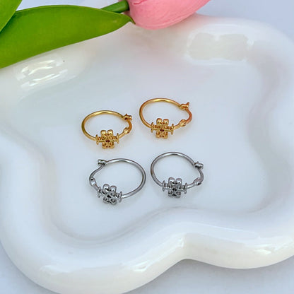 Set of gold- and silver-tone mini hoop earrings with logo charm