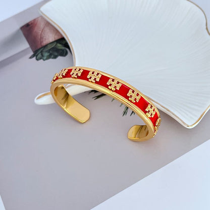 Enamel logo open metal cuff bangle, red enamel with gold-tone open hinge