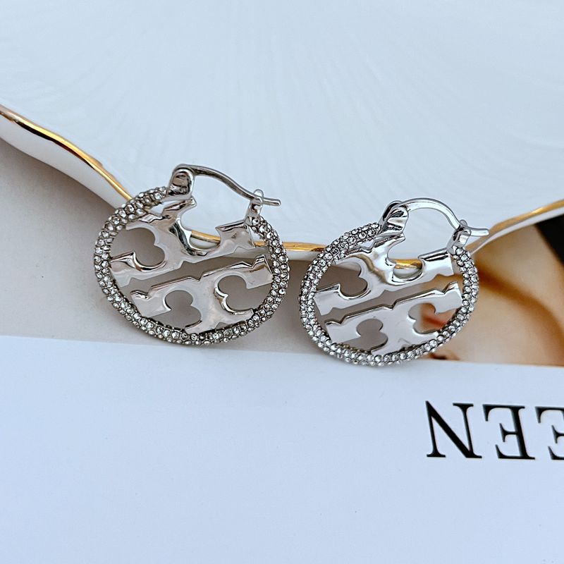 Tory Burch rhinestone openwork metal hoop earrings, silver-tone, textured rim and cutout motifs