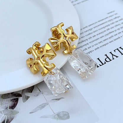 Gold-tone logo pendant earrings with clear acrylic drop charms