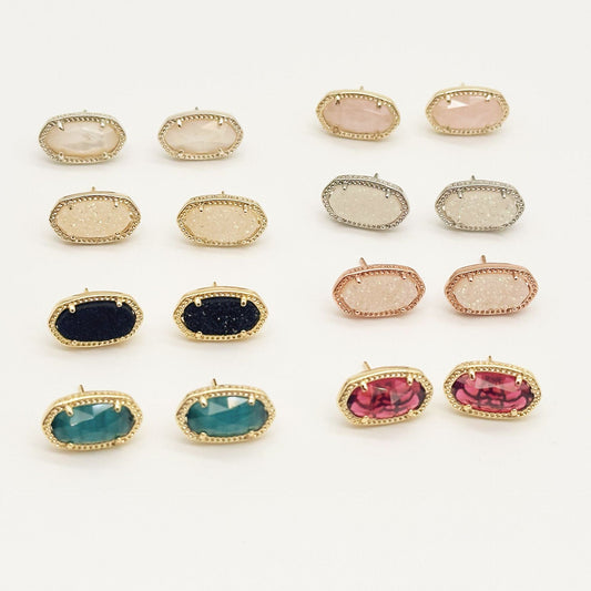 Kendra Scott oval gemstone stud earrings shown in multiple crystal colors and metal finishes
