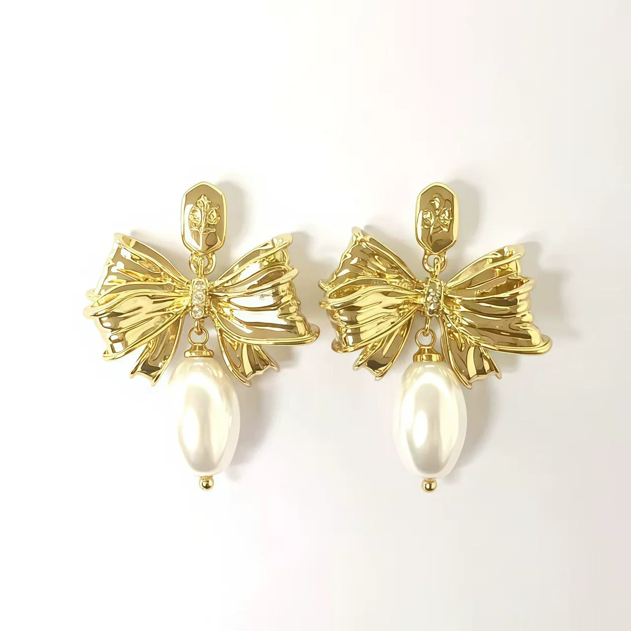 Enamel bow pearl drop stud earrings with gold-tone ribbon and pearly white drop