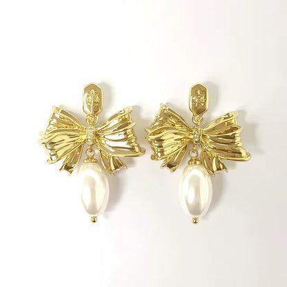 Enamel bow pearl drop stud earrings with gold-tone ribbon and pearly white drop
