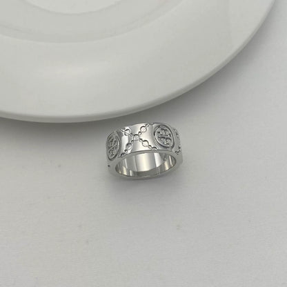 Silver-tone round logo metal ring with enamel clover pattern