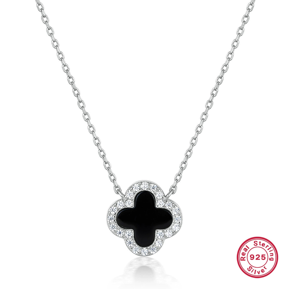 Silver-tone four-leaf clover necklace with black onyx center and clear stone border