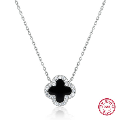 Silver-tone four-leaf clover necklace with black onyx center and clear stone border