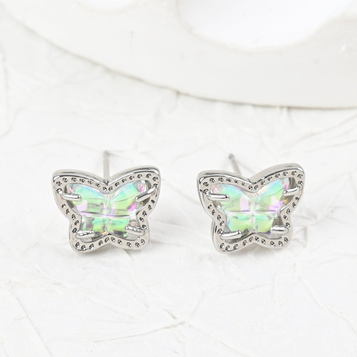 Silver butterfly stud earrings with iridescent multi-color stones, pair