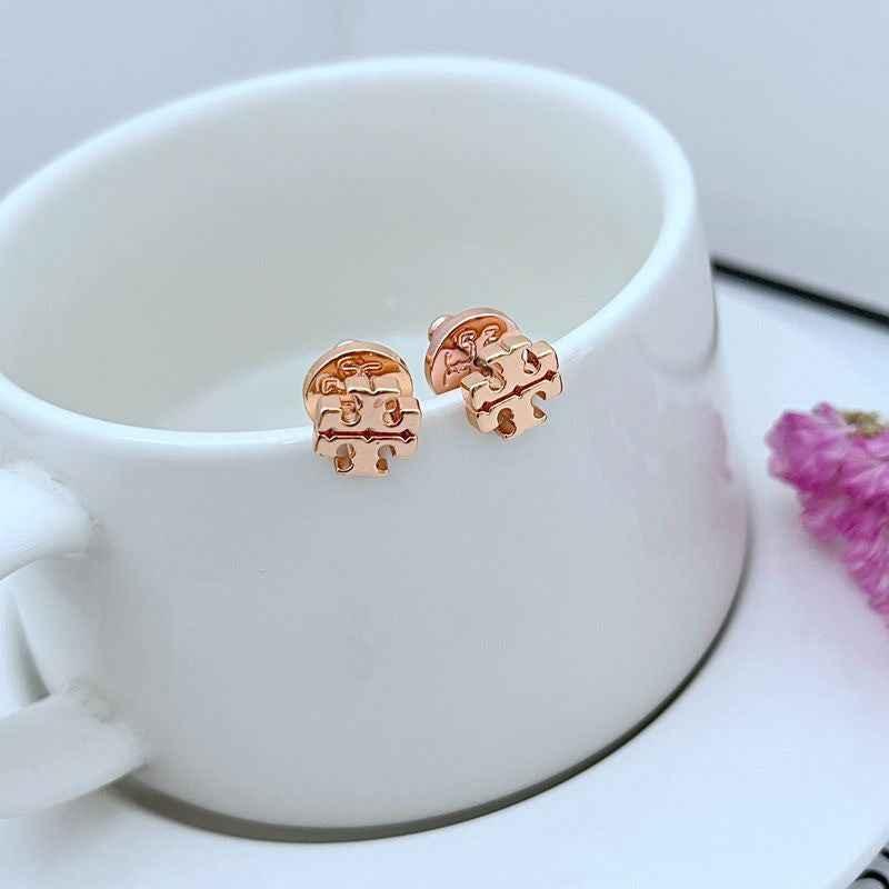 Tory Burch minimalist, shiny logo metal stud earrings - JIMMY JEWELRY 01
