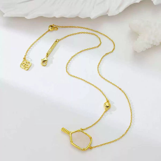 Gold tennis racket pendant necklace with heart and square charm accents